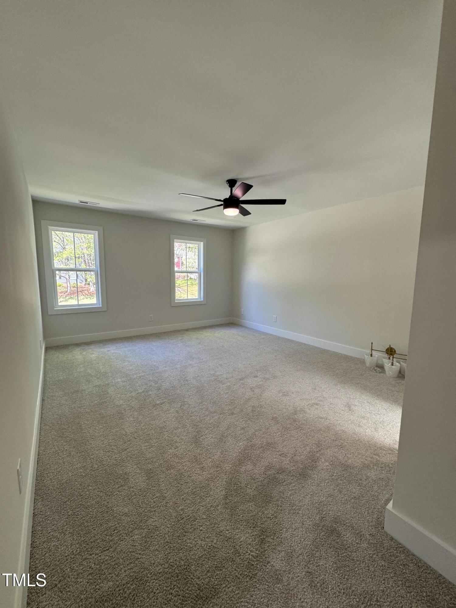 1326 Apache Lane Apex, NC 27502 - Photo 15 of 36 a view of an empty room with a window