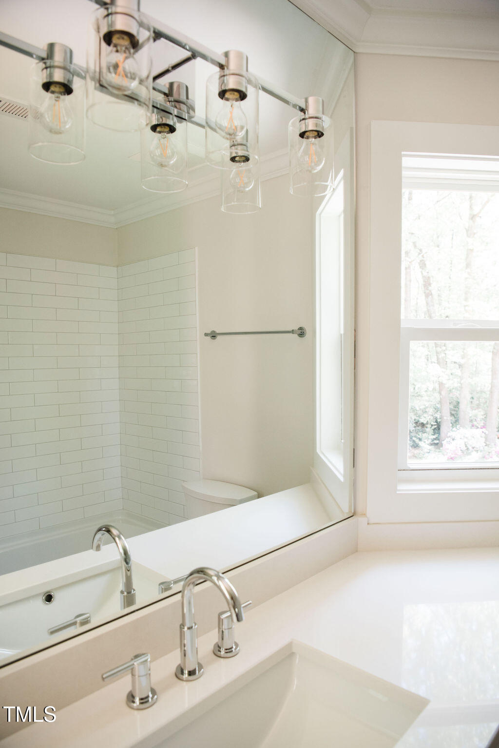 1326 Apache Lane Apex, NC 27502 - Photo 19 of 36 a bathroom with a bathtub and a sink