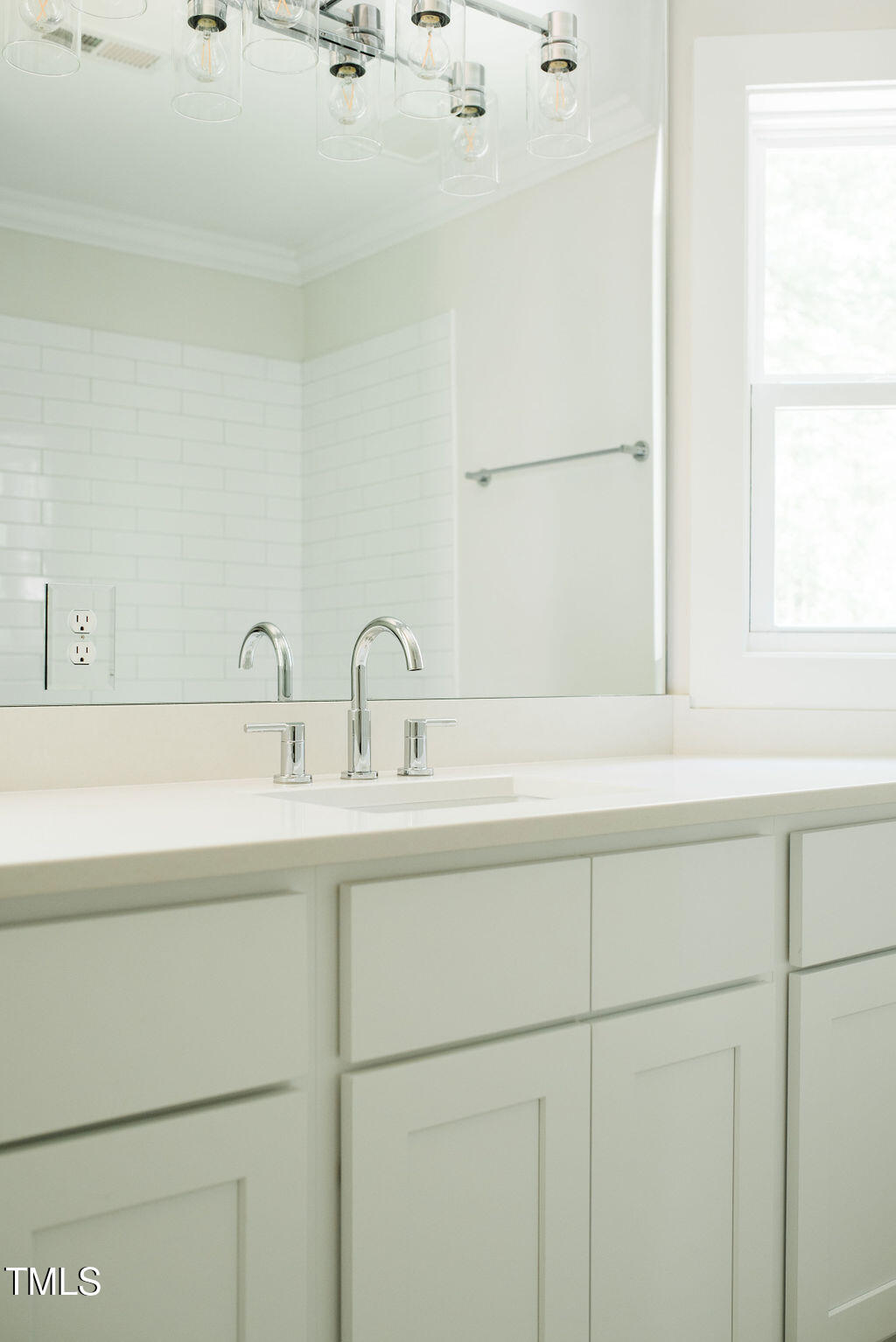 1326 Apache Lane Apex, NC 27502 - Photo 20 of 36 a bathroom with a sink and a mirror