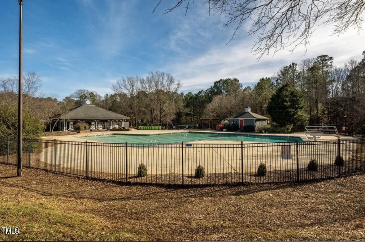 1326 Apache Lane Apex, NC 27502 - Photo 34 of 36 a view of a house with a yard