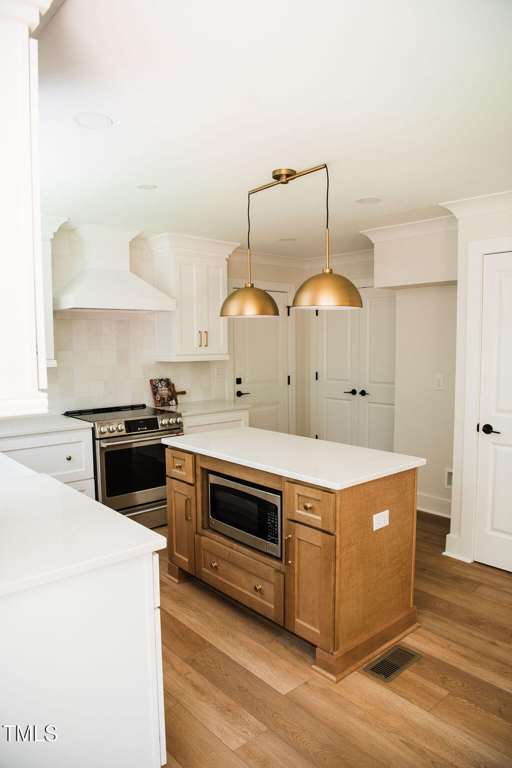 1326 Apache Lane Apex, NC 27502 - Photo 4 of 36 a kitchen with a stove and a refrigerator