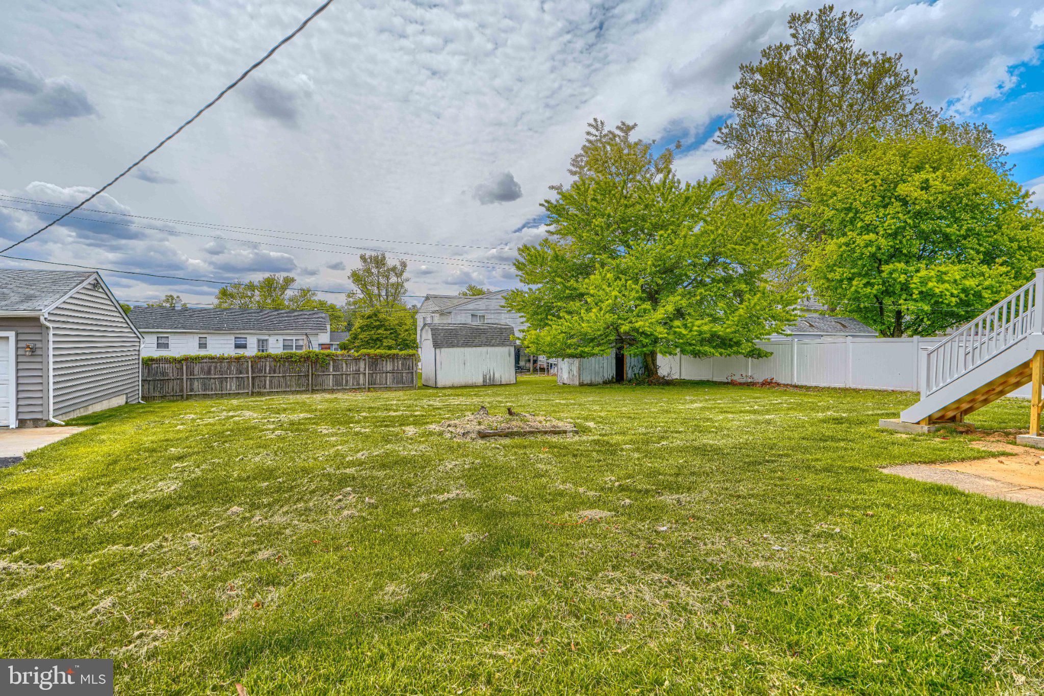 3910 Carthage Road Randallstown, MD 21133 - Photo 5 of 42 Spacious backyard with lush greenery.