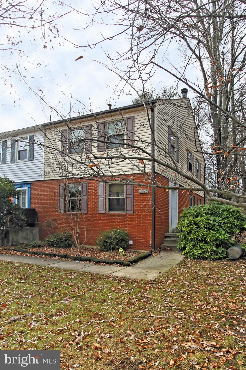 8126 Imperial Drive, Unit 5H Laurel, MD 20708 - Photo 1 of 30 a front view of a house with trees