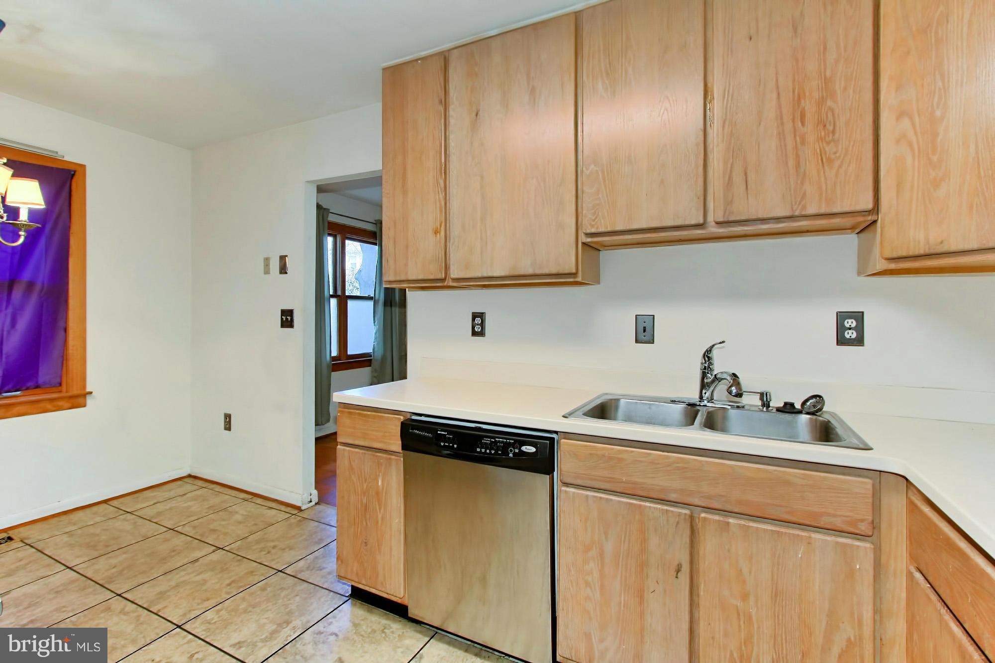 8126 Imperial Drive, Unit 5H Laurel, MD 20708 - Photo 10 of 30 a kitchen with stainless steel appliances granite countertop a sink and a white cabinets