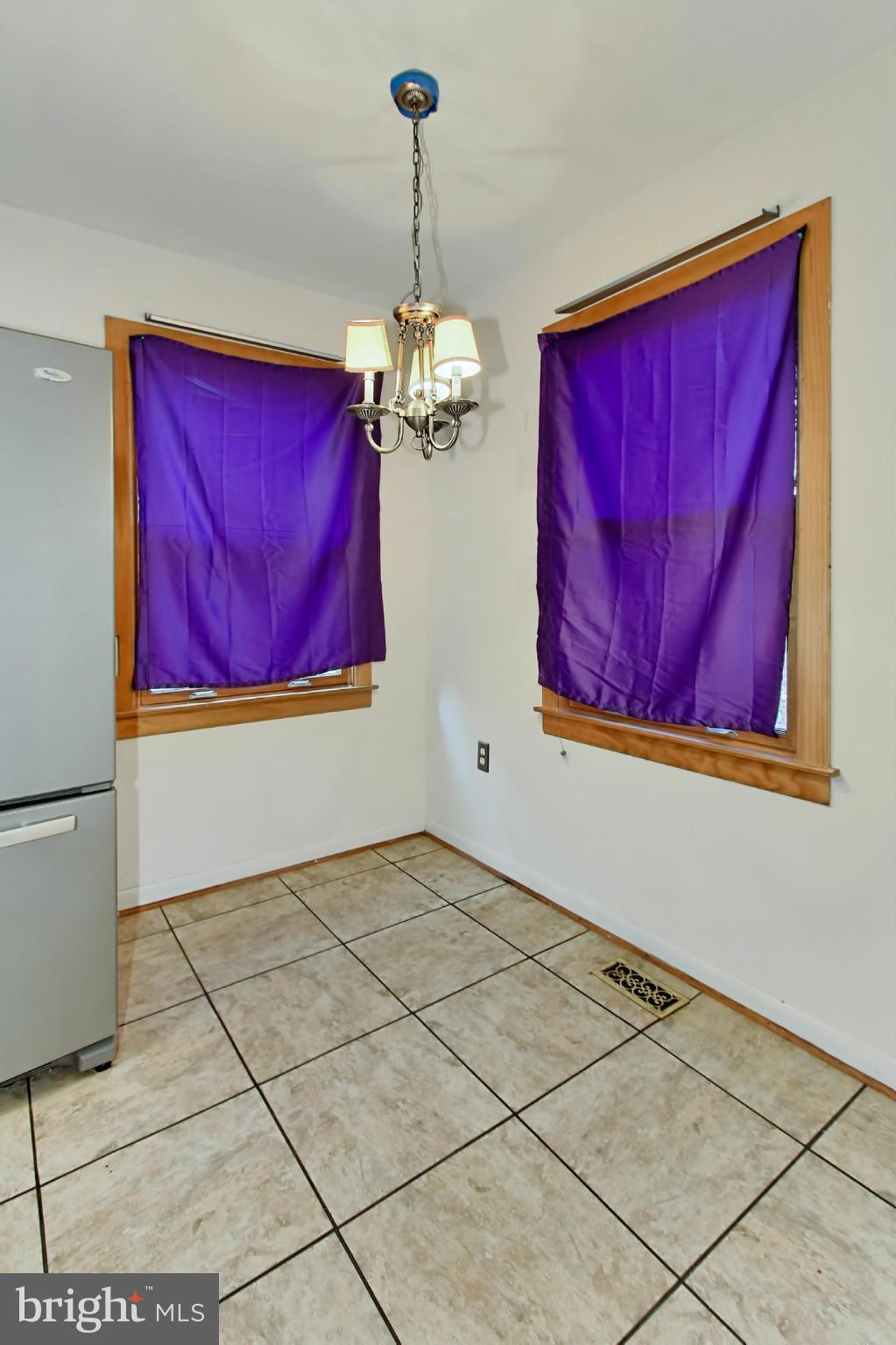 8126 Imperial Drive, Unit 5H Laurel, MD 20708 - Photo 12 of 30 a view of a room with wooden floor and windows