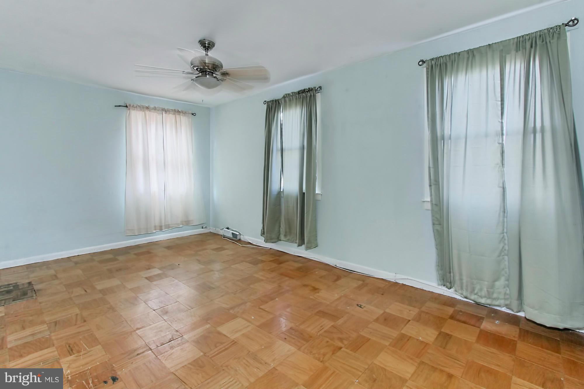 8126 Imperial Drive, Unit 5H Laurel, MD 20708 - Photo 18 of 30 wooden floor in an empty room with a window