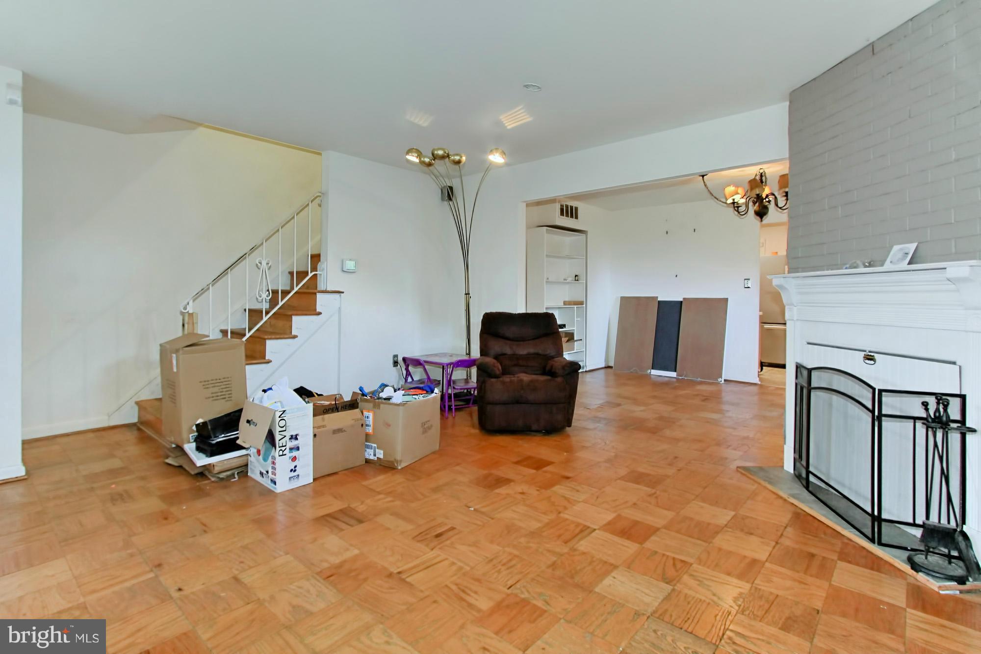 8126 Imperial Drive, Unit 5H Laurel, MD 20708 - Photo 3 of 30 a living room with furniture and a fireplace