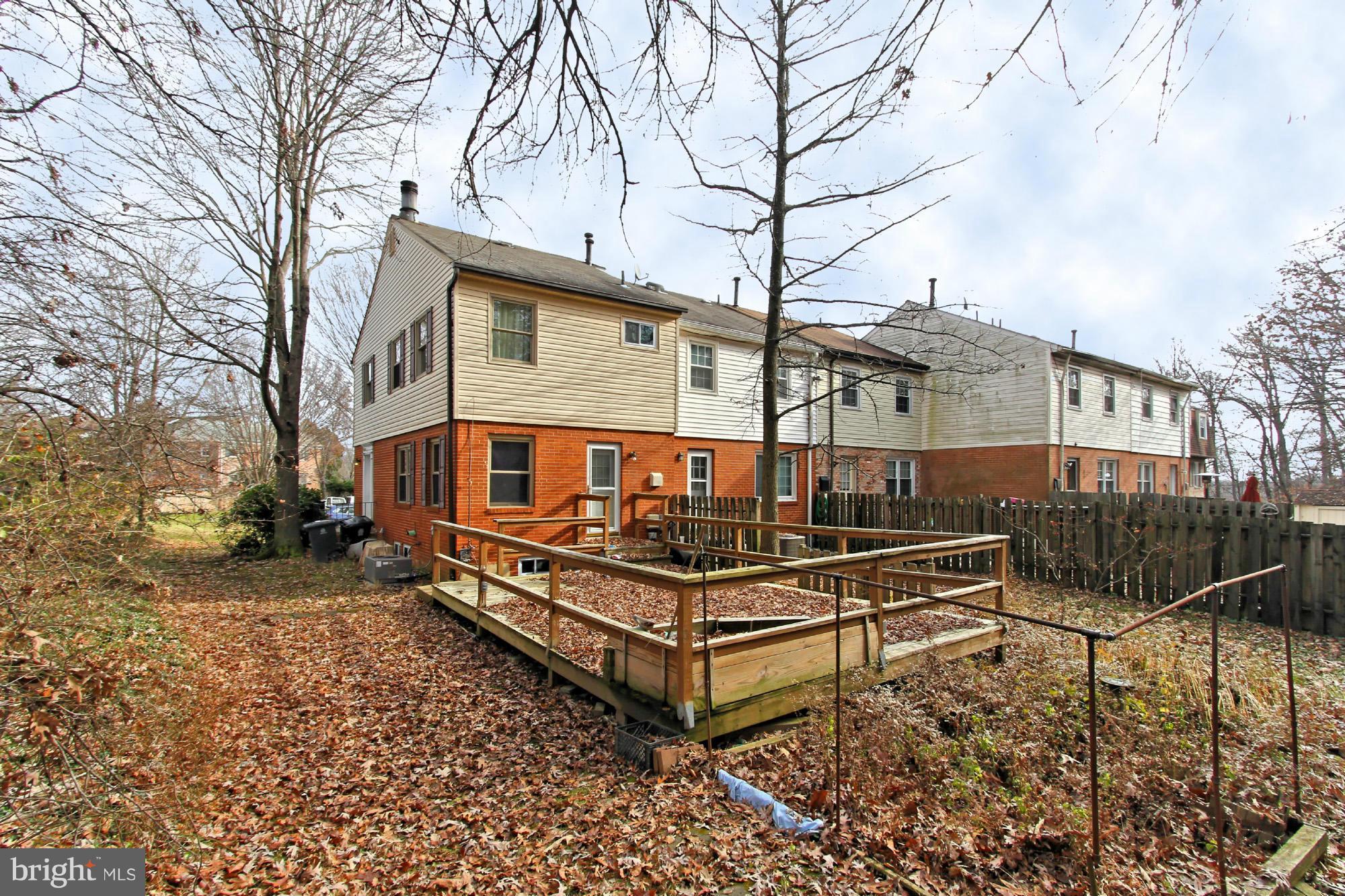 8126 Imperial Drive, Unit 5H Laurel, MD 20708 - Photo 28 of 30 a view of a roof deck with wooden fence and a couple of chairs