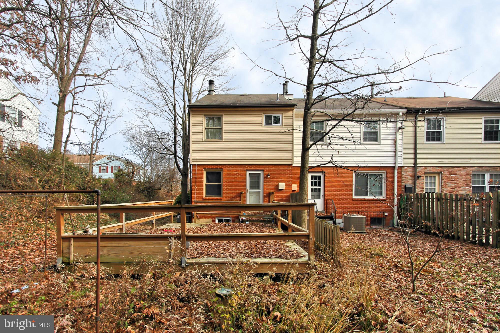 8126 Imperial Drive, Unit 5H Laurel, MD 20708 - Photo 29 of 30 front view of a house with a bench