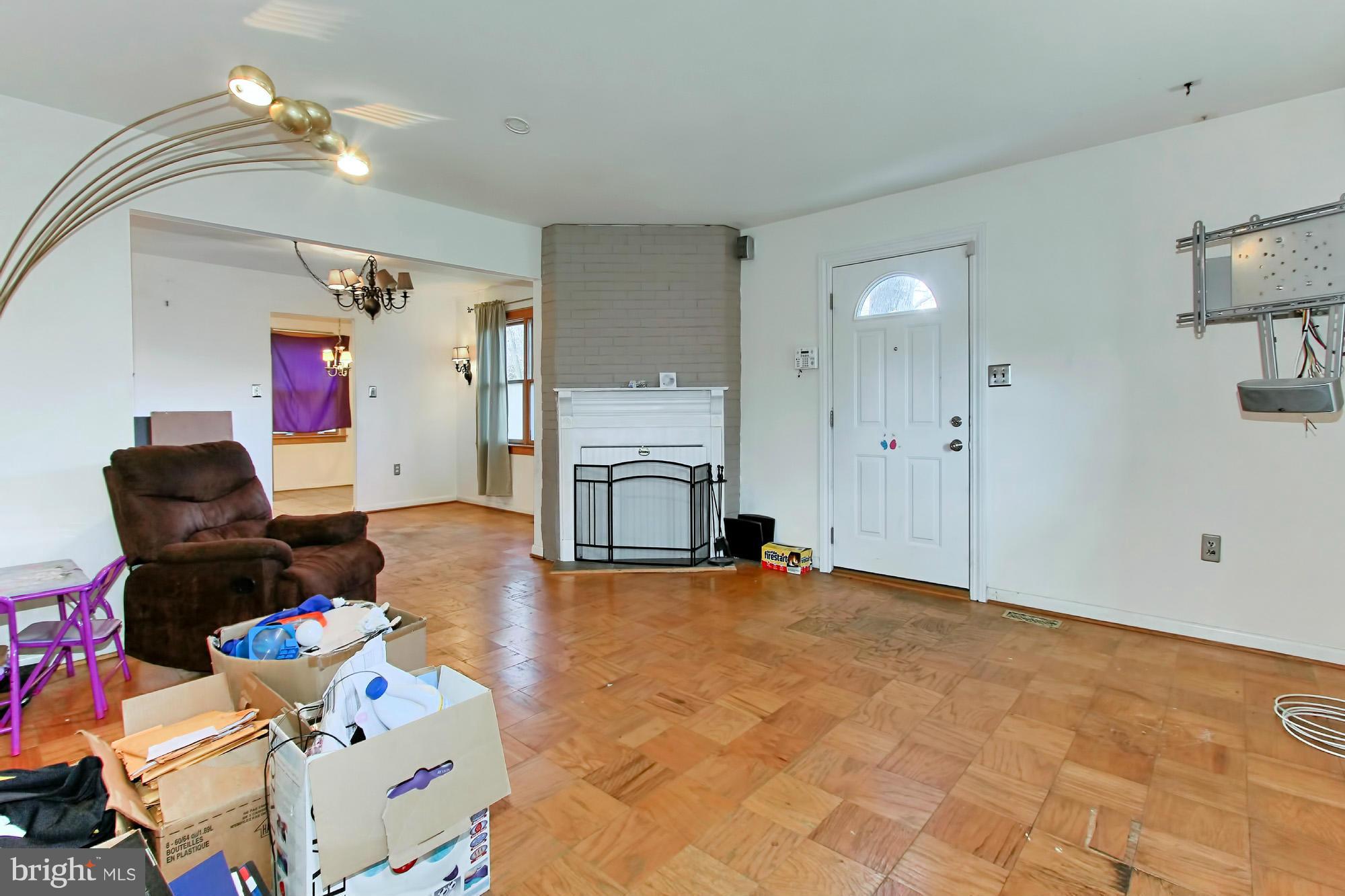 8126 Imperial Drive, Unit 5H Laurel, MD 20708 - Photo 4 of 30 a living room with furniture and a fireplace