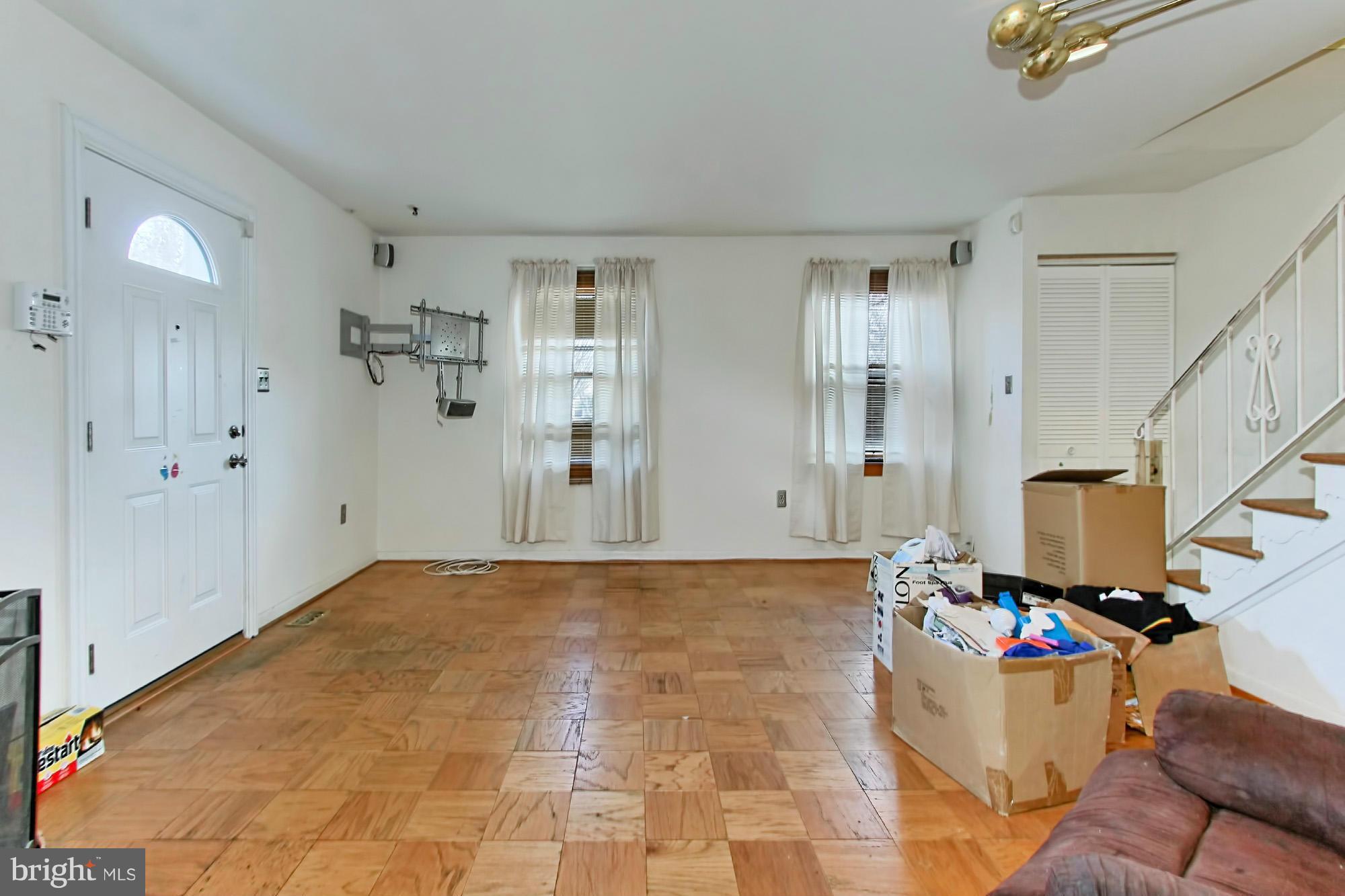 8126 Imperial Drive, Unit 5H Laurel, MD 20708 - Photo 5 of 30 a view of a room with wooden floor and windows