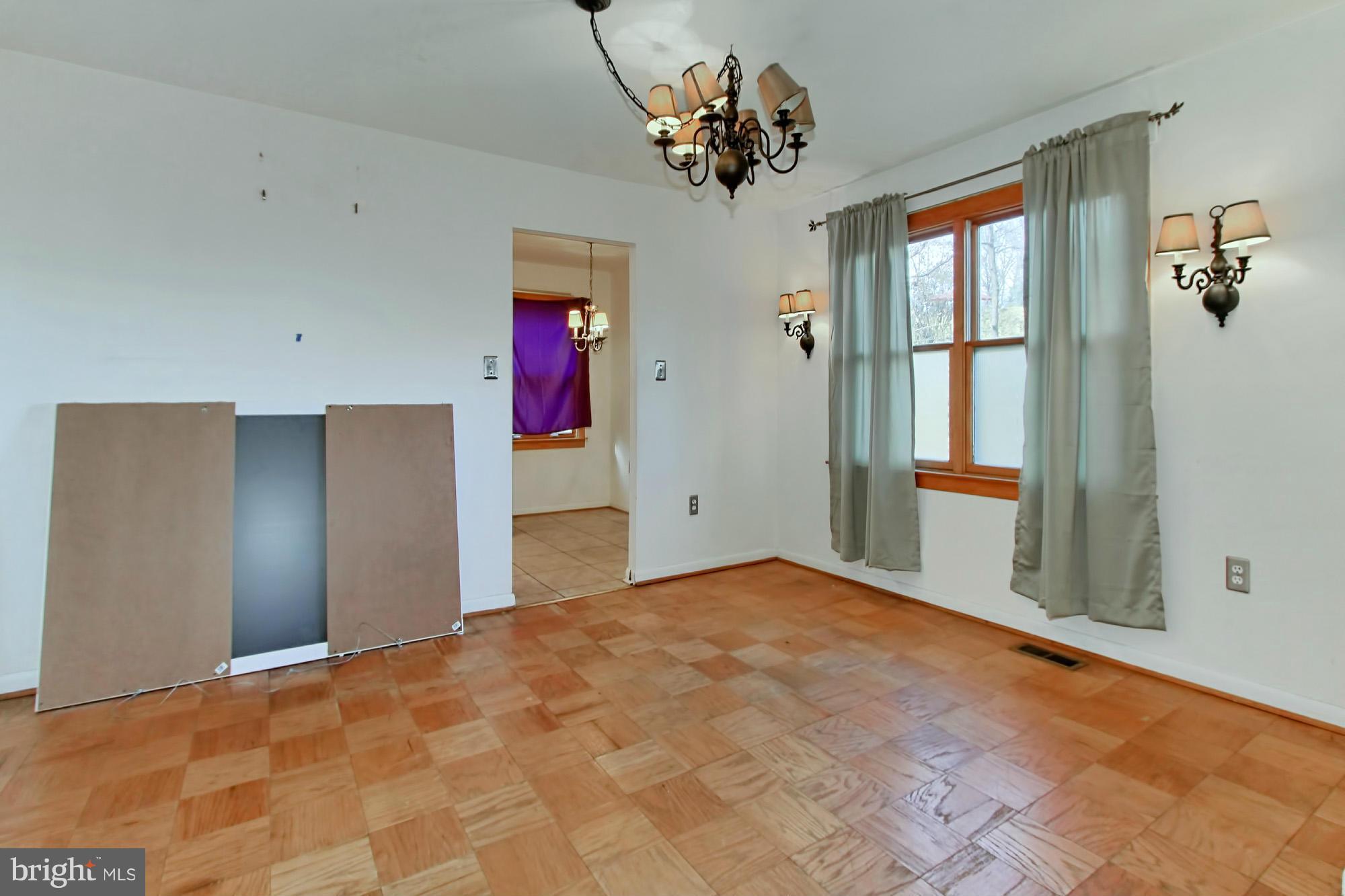 8126 Imperial Drive, Unit 5H Laurel, MD 20708 - Photo 6 of 30 a view of a big room with a chandelier fan and windows
