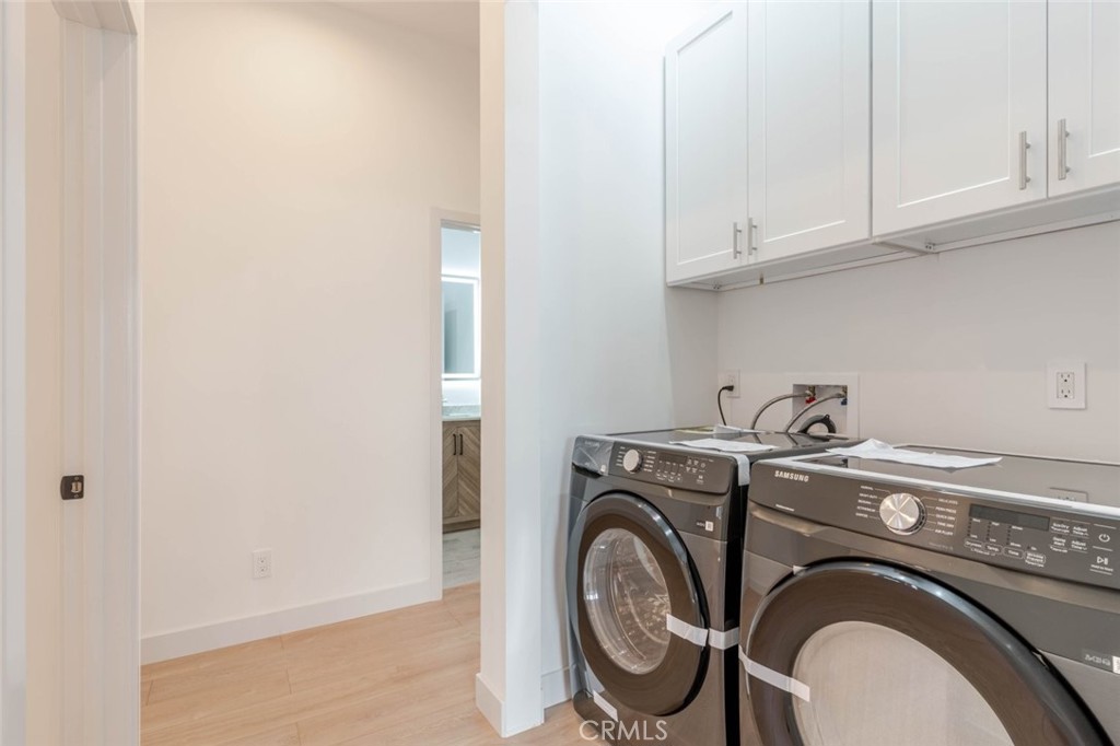 6852 1/2 Ranchito Avenue Van Nuys, CA 91405 - Photo 15 of 17 a utility room with dryer and washer