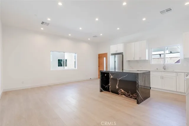 a view of workspace with furniture and window