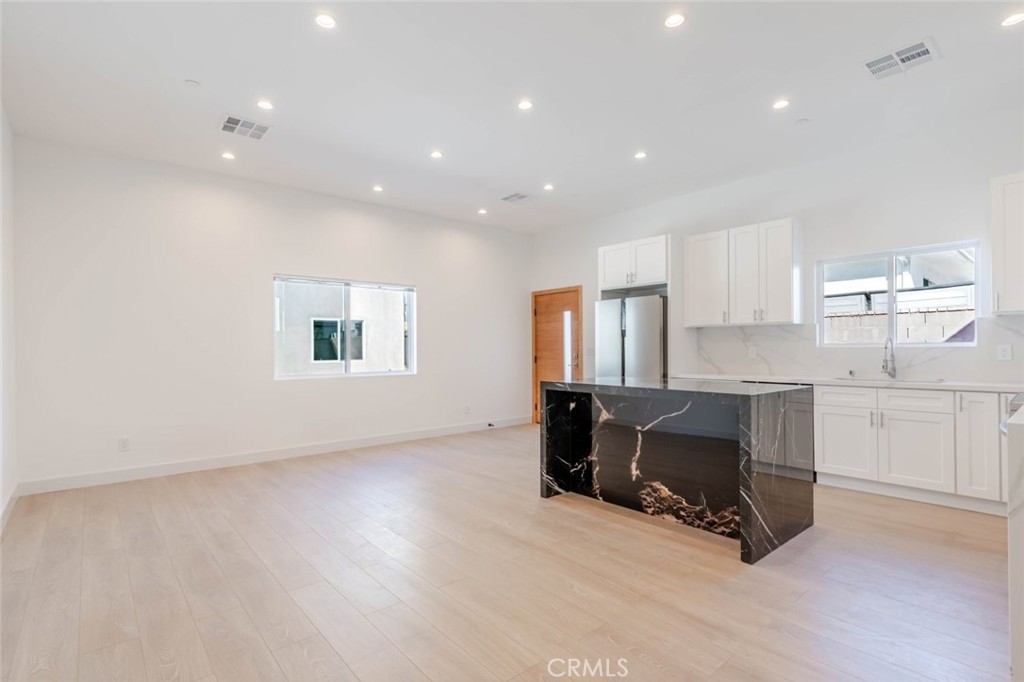 6852 1/2 Ranchito Avenue Van Nuys, CA 91405 - Photo 5 of 17 a view of workspace with furniture and window
