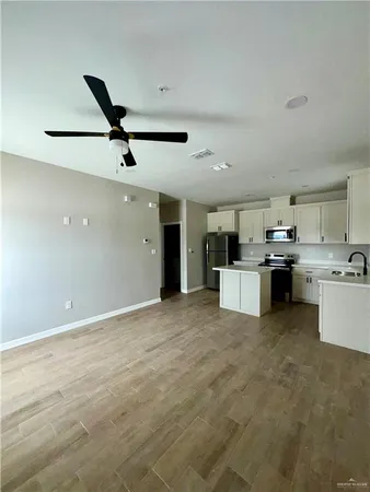 a view of kitchen with stainless steel appliances kitchen island