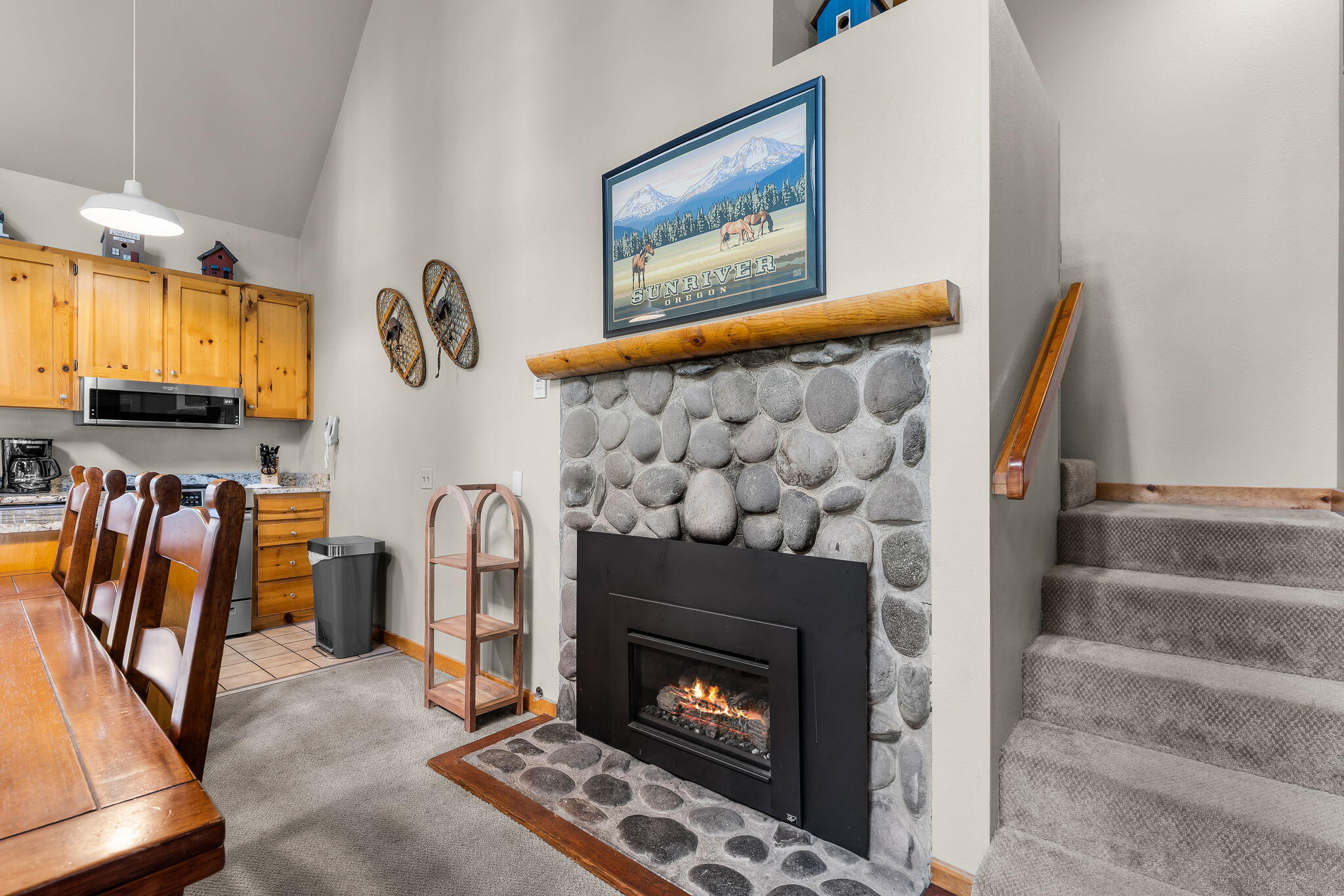 57505 Circle 4 Cabin Road, Unit 29 Sunriver, OR 97707 - Photo 14 of 35 a bed room with a fireplace and a painting on the wall