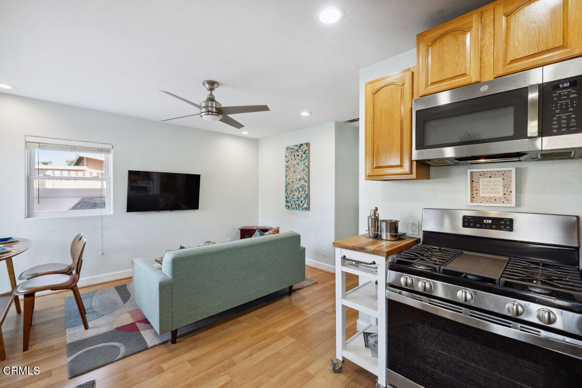 3701 Sunset Lane Oxnard, CA 93035 - Photo 12 of 54 a kitchen with stainless steel appliances granite countertop a stove a microwave a sink and cabinets