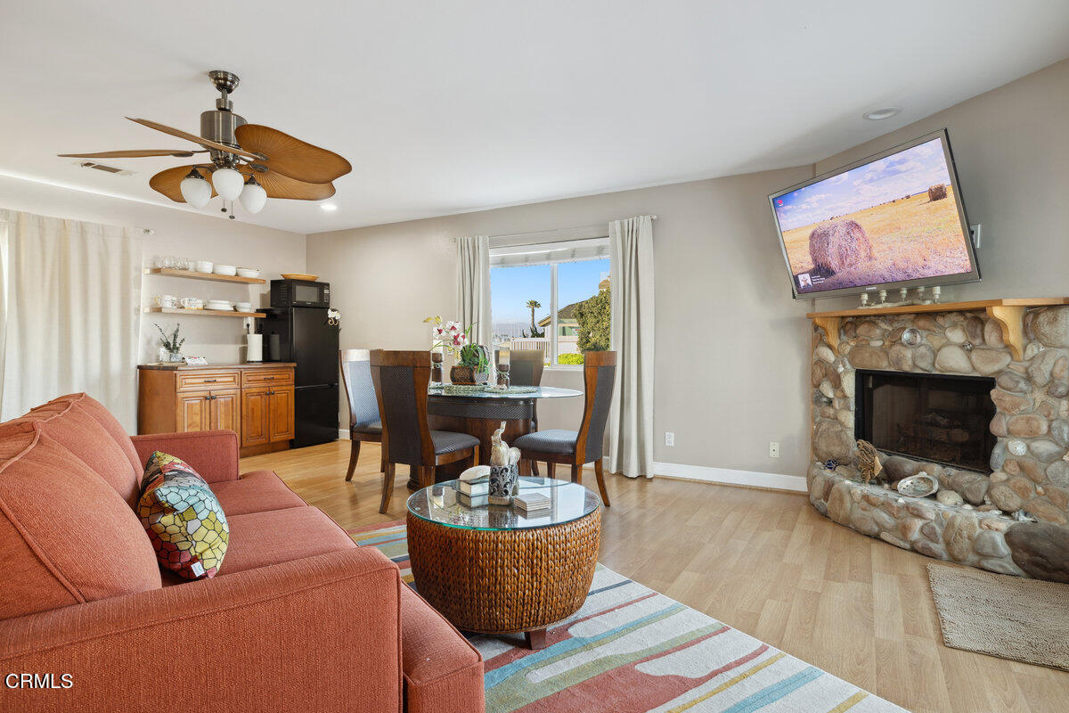 3701 Sunset Lane Oxnard, CA 93035 - Photo 19 of 54 a living room with furniture and a fireplace