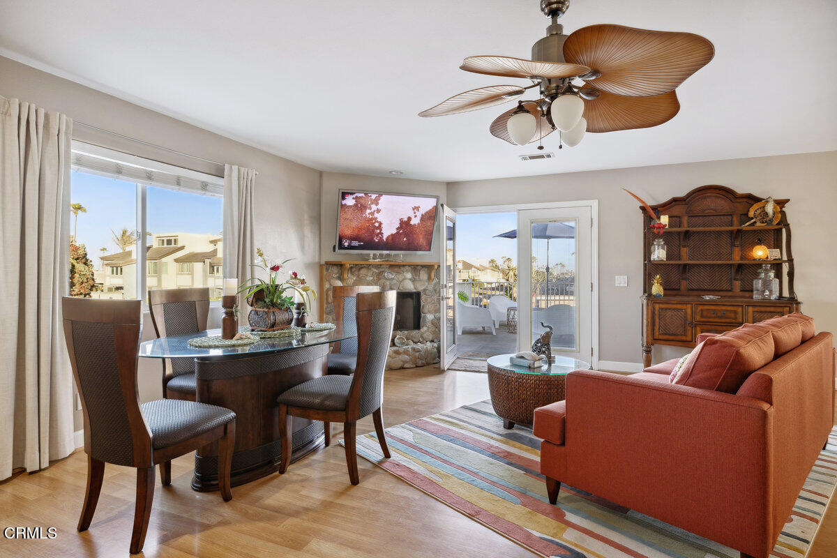 3701 Sunset Lane Oxnard, CA 93035 - Photo 21 of 54 a living room with furniture a flat screen tv and a window