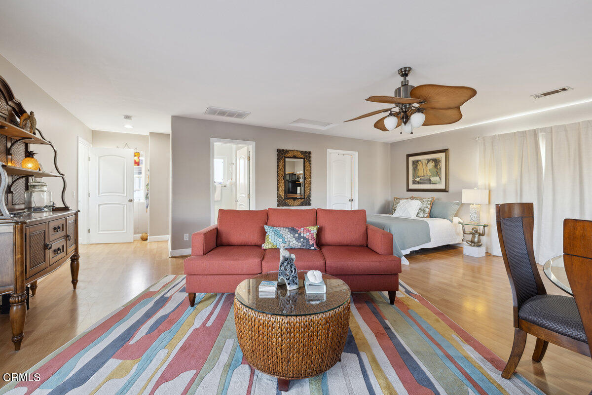 3701 Sunset Lane Oxnard, CA 93035 - Photo 22 of 54 a living room with furniture and a wooden floor