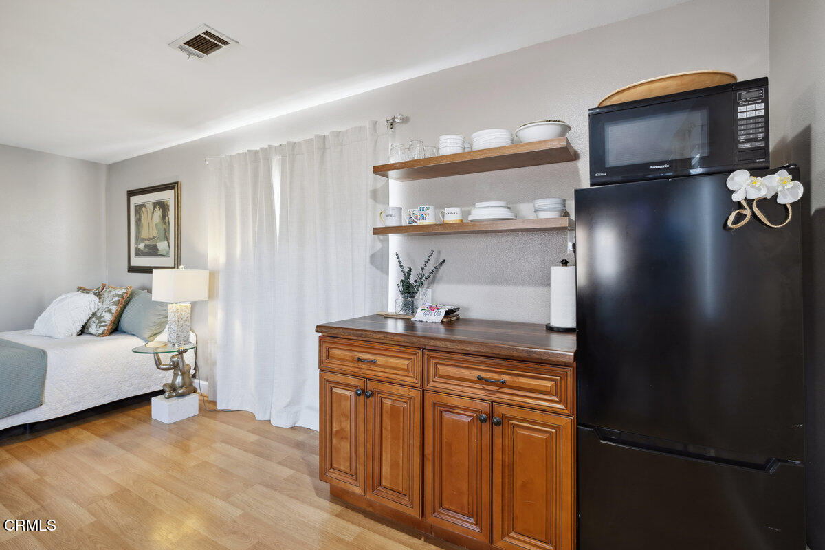 3701 Sunset Lane Oxnard, CA 93035 - Photo 23 of 54 a living room with furniture and a flat screen tv