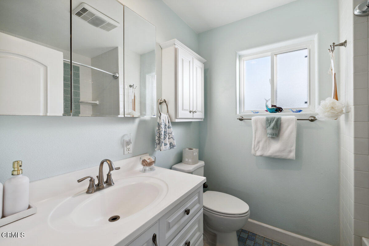 3701 Sunset Lane Oxnard, CA 93035 - Photo 25 of 54 a bathroom with a sink a toilet and mirror