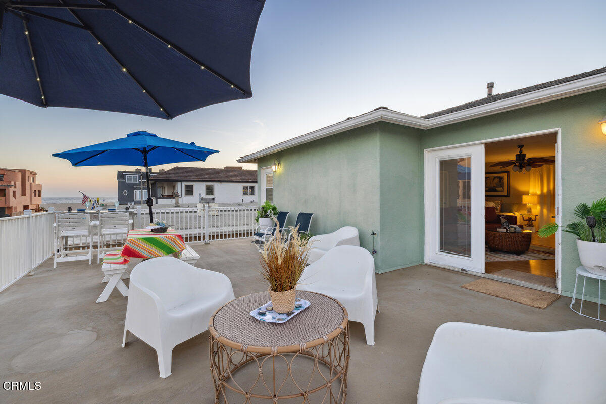 3701 Sunset Lane Oxnard, CA 93035 - Photo 27 of 54 a view of a dining room with furniture and chandelier