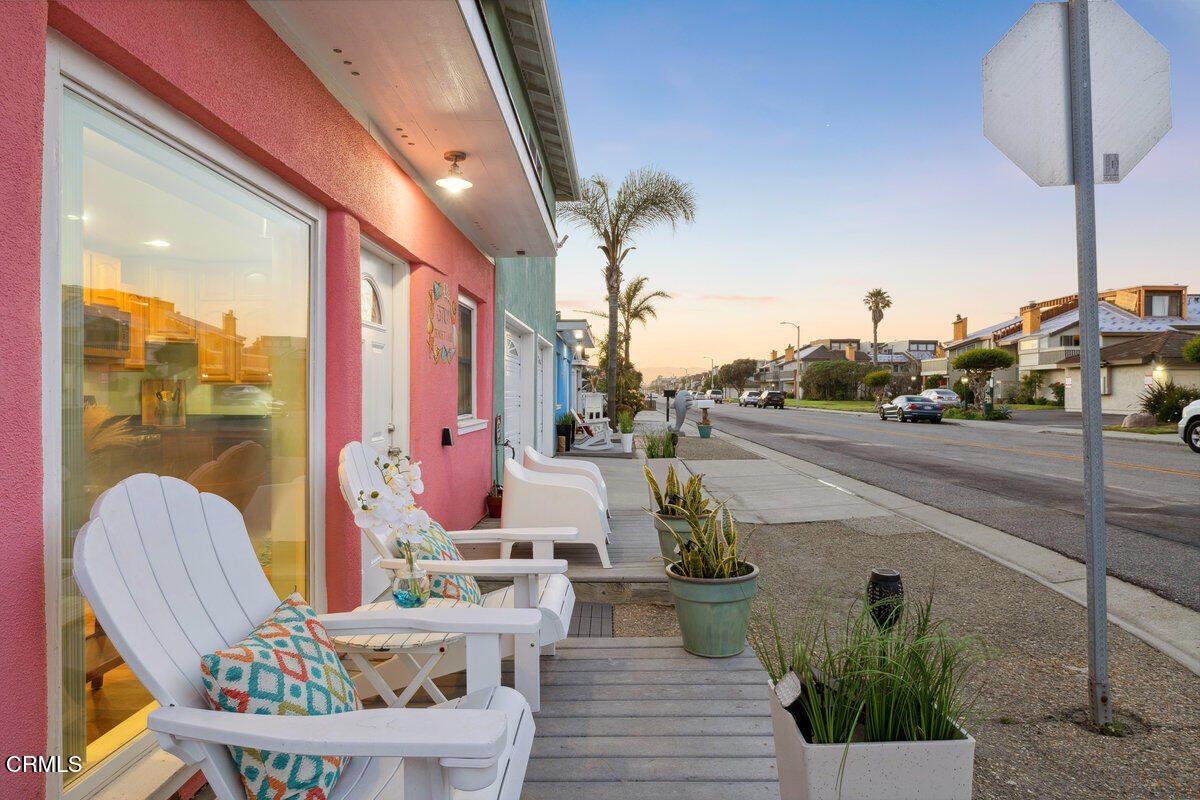 3701 Sunset Lane Oxnard, CA 93035 - Photo 32 of 54 a front view of a house with outdoor seating