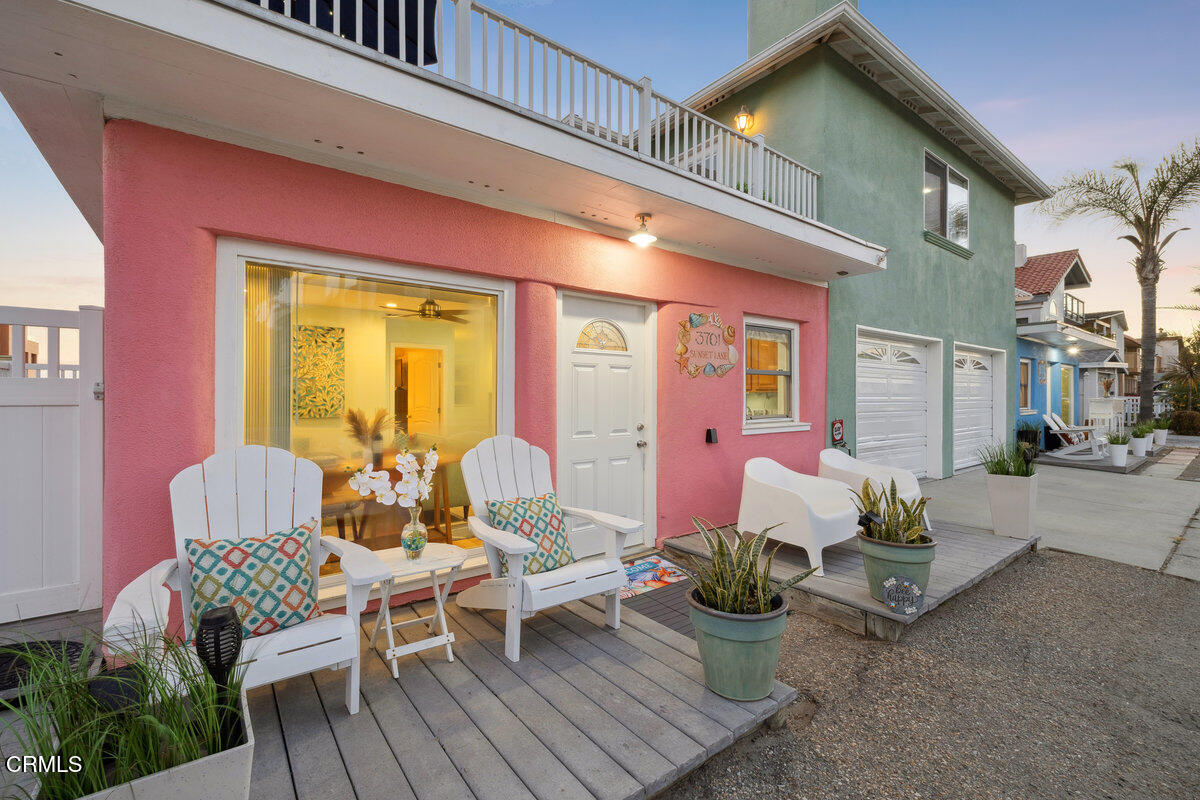3701 Sunset Lane Oxnard, CA 93035 - Photo 33 of 54 a view of a patio with couches table and chairs and potted plants