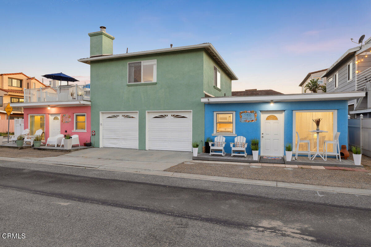 3701 Sunset Lane Oxnard, CA 93035 - Photo 34 of 54 a front view of a house with lots of windows and couches