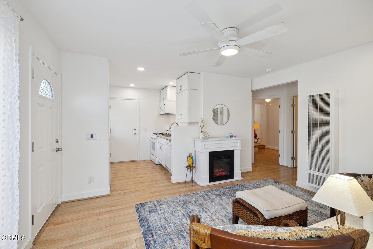 3701 Sunset Lane Oxnard, CA 93035 - Photo 40 of 54 a living room with furniture and a fireplace