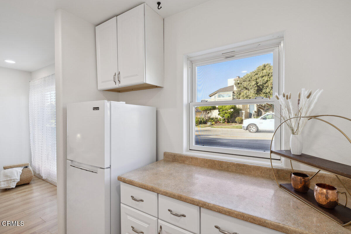 3701 Sunset Lane Oxnard, CA 93035 - Photo 42 of 54 a white refrigerator freezer sitting inside of a kitchen