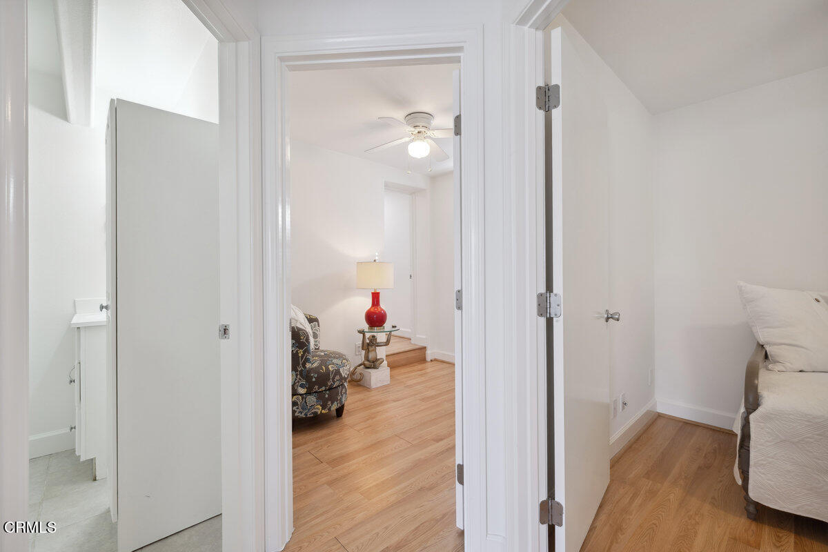 3701 Sunset Lane Oxnard, CA 93035 - Photo 44 of 54 a view of a hallway with wooden floor and a living room