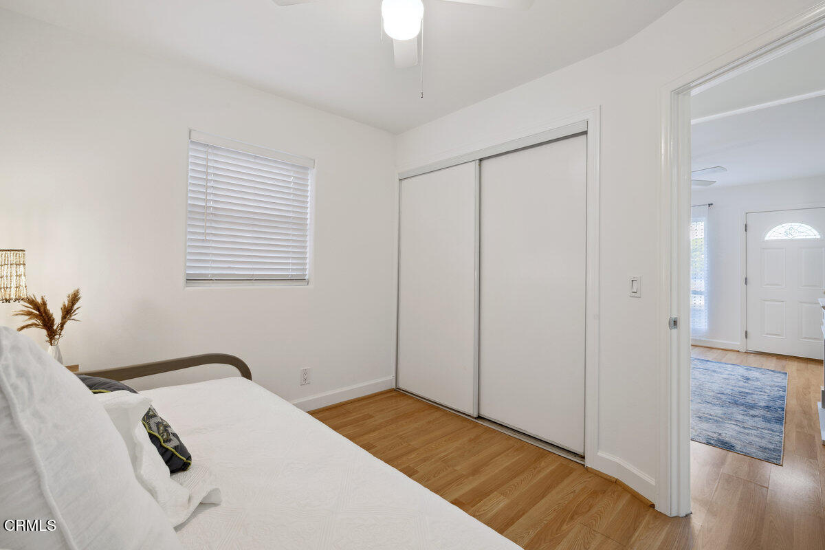 3701 Sunset Lane Oxnard, CA 93035 - Photo 46 of 54 a bedroom with a bed and a chandelier