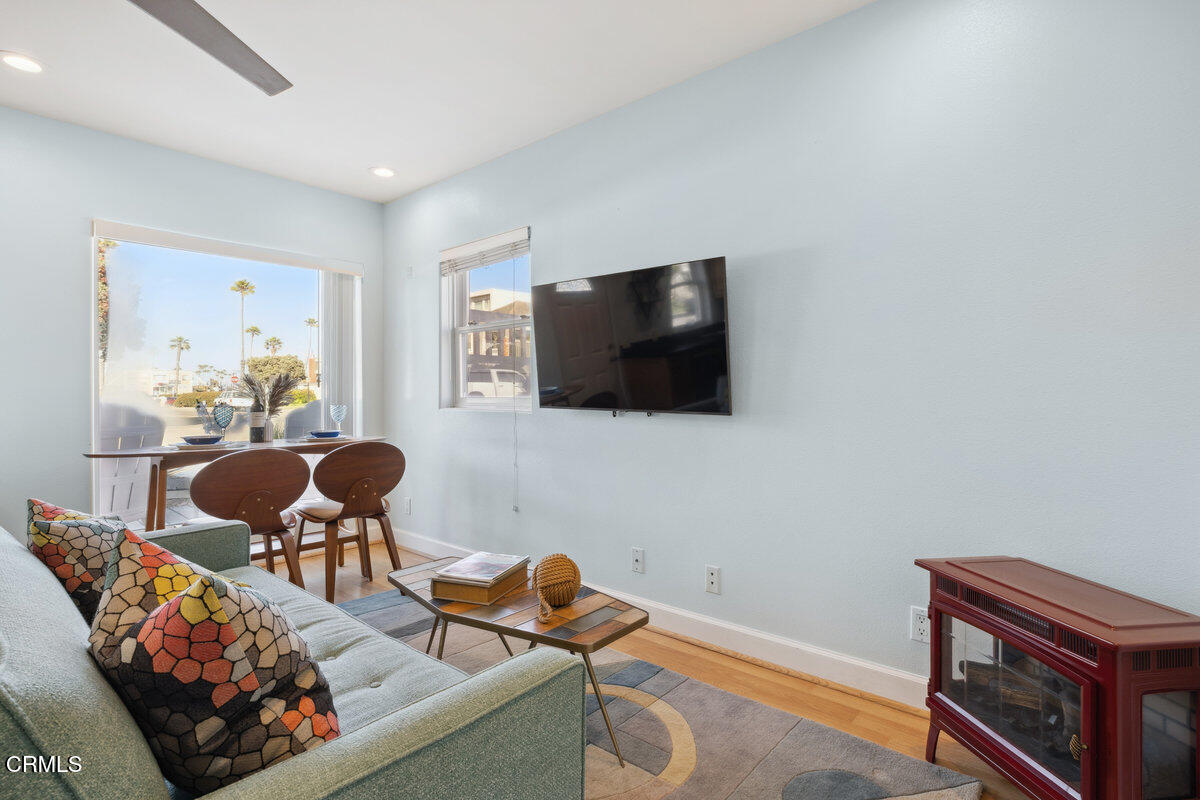 3701 Sunset Lane Oxnard, CA 93035 - Photo 6 of 54 a living room with furniture and a flat screen tv