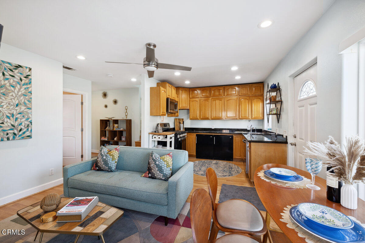 3701 Sunset Lane Oxnard, CA 93035 - Photo 8 of 54 a living room with furniture kitchen view and a large window