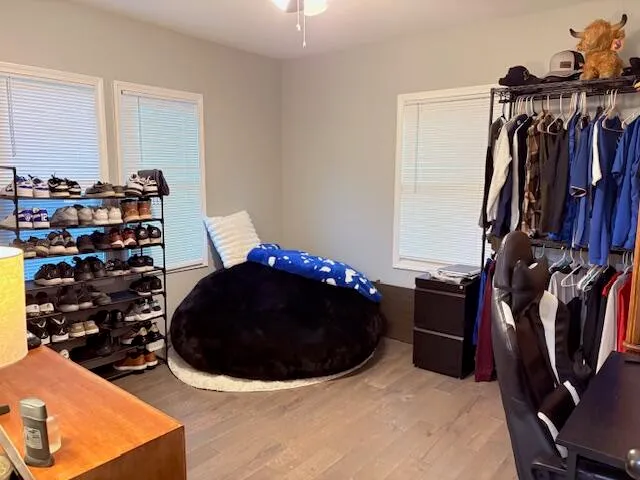 a bedroom with a bed and a lamp