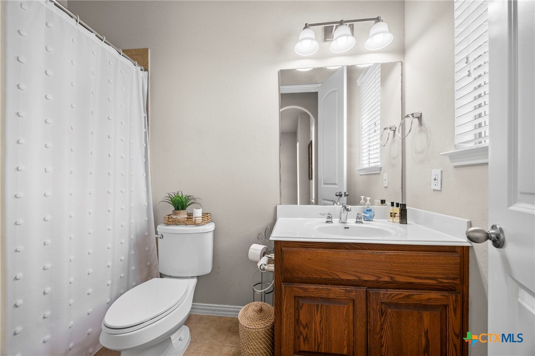 1205 Winding Way Drive Georgetown, TX 78628 - Photo 18 of 39 Shower/tub combo and single vanity in third bath.
