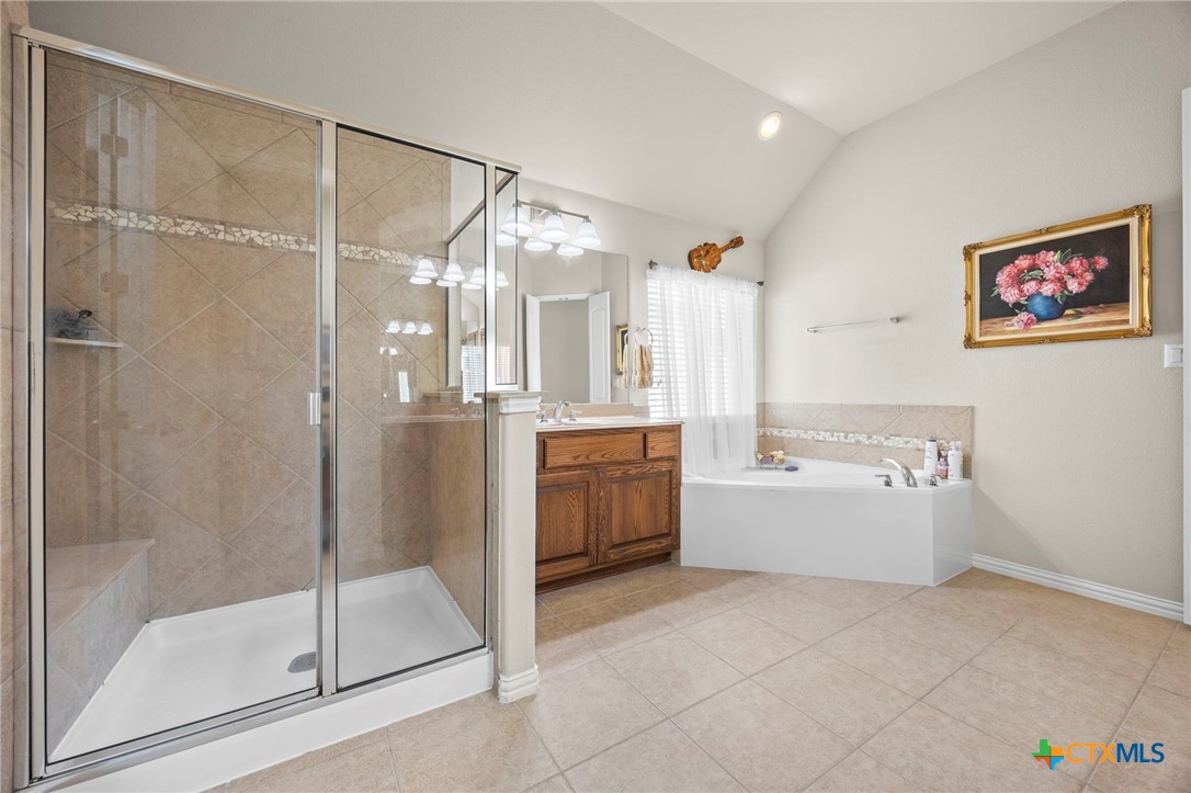 1205 Winding Way Drive Georgetown, TX 78628 - Photo 32 of 39 The bathroom has a separate tun and shower with bench