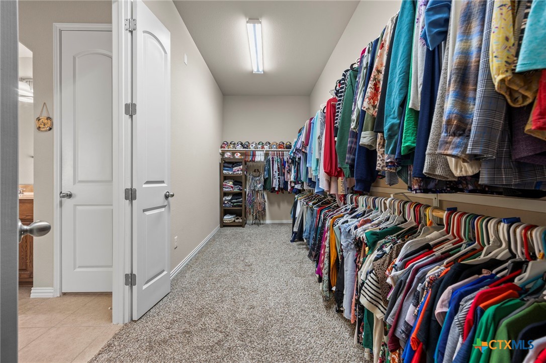 1205 Winding Way Drive Georgetown, TX 78628 - Photo 33 of 39 Huge walk in closet with built in shelving.