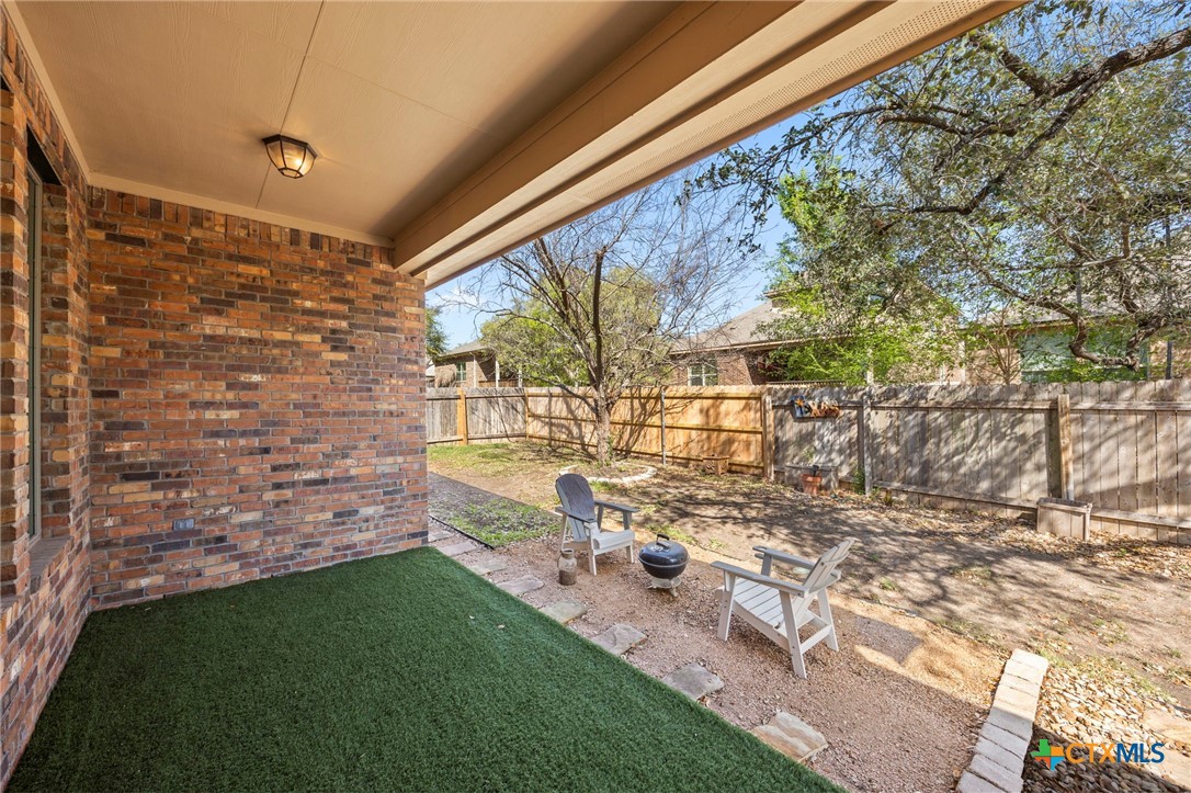 1205 Winding Way Drive Georgetown, TX 78628 - Photo 35 of 39 The back covered patio provides ample amount of shade.