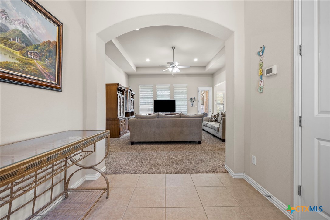 1205 Winding Way Drive Georgetown, TX 78628 - Photo 6 of 39 The tile entryway opens up to the living room with recessed lighting and ceiling fan.