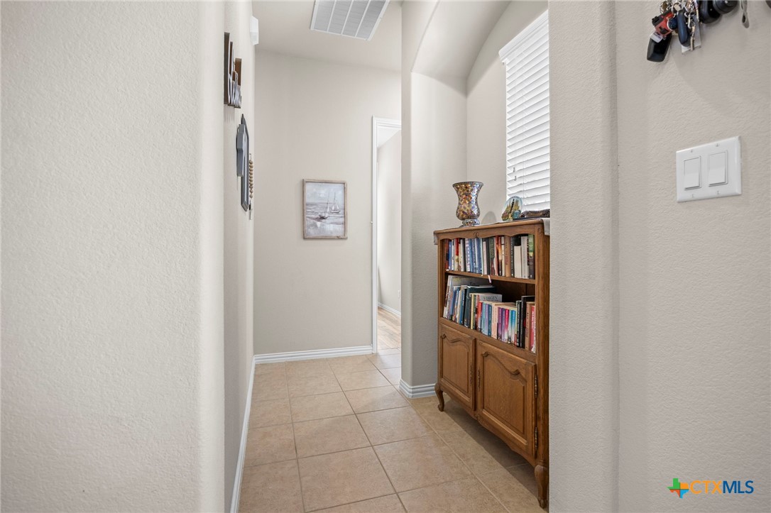 1205 Winding Way Drive Georgetown, TX 78628 - Photo 10 of 39 Hallway that overlooks the courtyard.