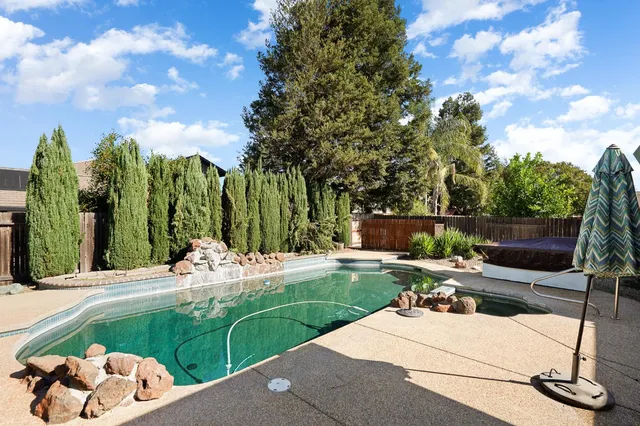 a view of a backyard with sitting area