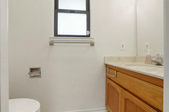 a view of a house with backyard sitting area and garden