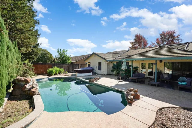 a outdoor living space with furniture and garden view