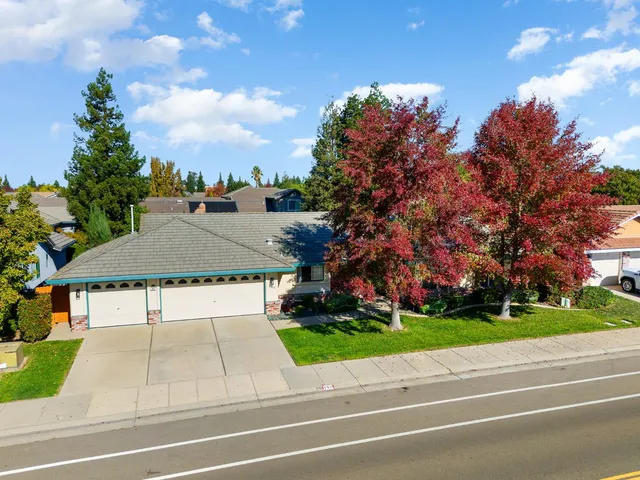 an aerial view of residential houses with outdoor space
