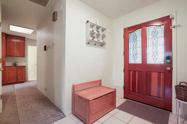 a view of a hallway with front door