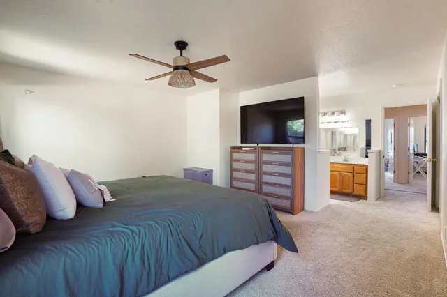 a bedroom with a bed and a television in it